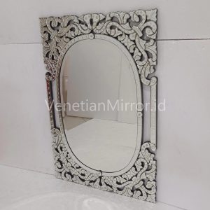 Ornate silver Venetian mirror with detailed floral frame